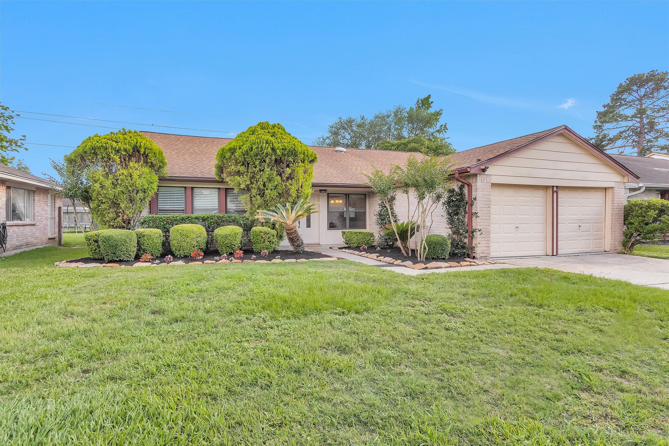 4807 Bridgemont Lane Spring, TX 77388 - Photo 2 of 42 Home boasts mature landscaping and crape myrtles will be blooming soon for a beautiful display of color.