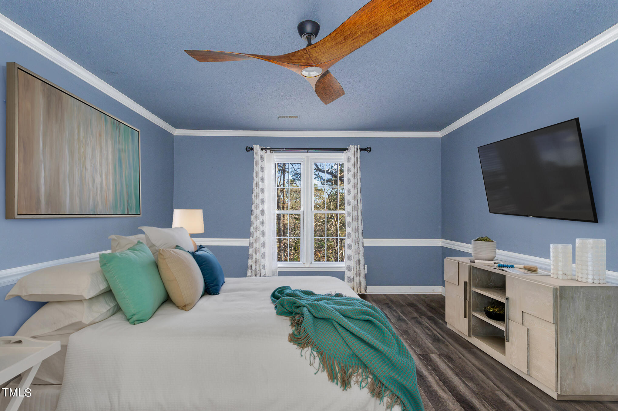 2903 Tavistock Drive Durham, NC 27712 - Photo 17 of 28 a bedroom with furniture and a flat screen tv