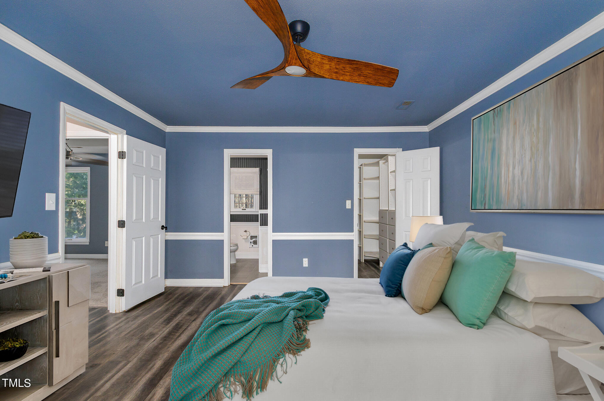 2903 Tavistock Drive Durham, NC 27712 - Photo 18 of 28 a bedroom with a bed and ceiling fan