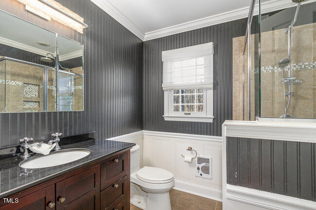 2903 Tavistock Drive Durham, NC 27712 - Photo 19 of 28 a bathroom with a granite countertop sink toilet a mirror and shower