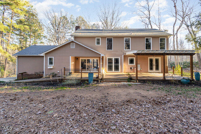2903 Tavistock Drive Durham, NC 27712 - Photo 25 of 28 a house with trees in the background