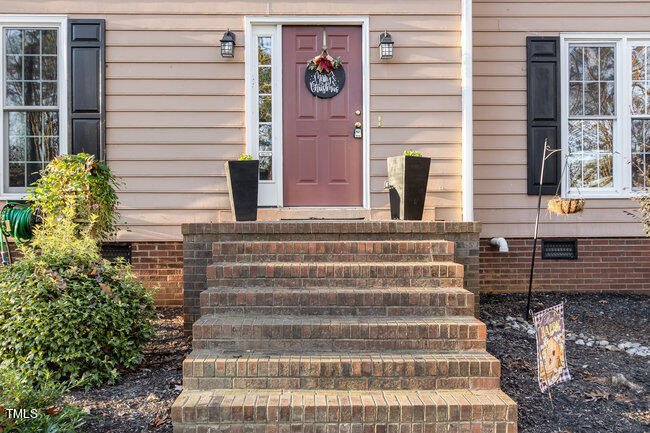 2903 Tavistock Drive Durham, NC 27712 - Photo 3 of 28 a front view of a house with windows and plants