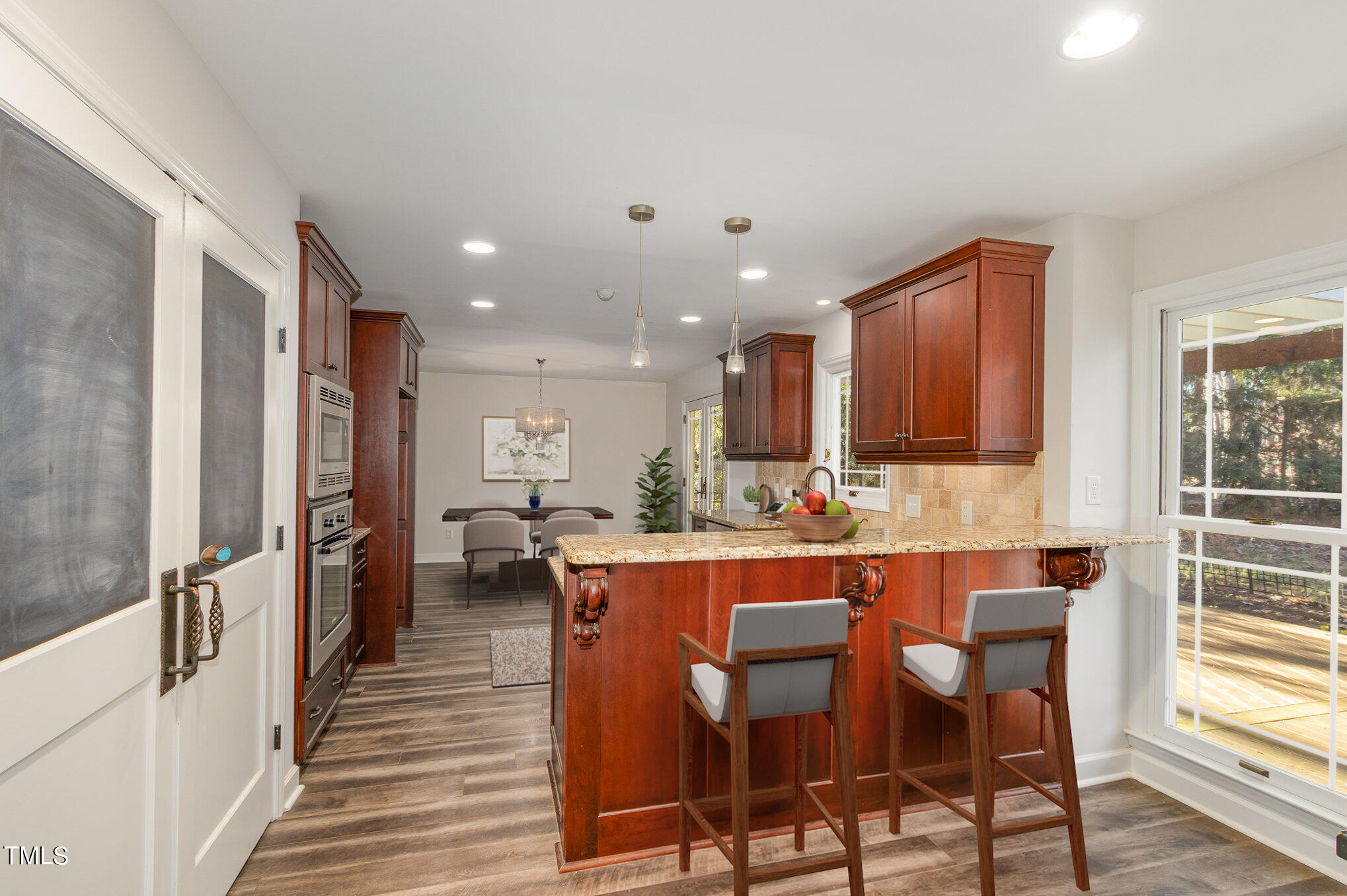 2903 Tavistock Drive Durham, NC 27712 - Photo 6 of 28 a large kitchen with a table and chairs