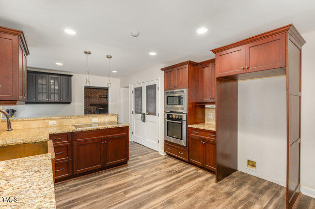 2903 Tavistock Drive Durham, NC 27712 - Photo 9 of 28 a large kitchen with stainless steel appliances granite countertop a refrigerator and a sink