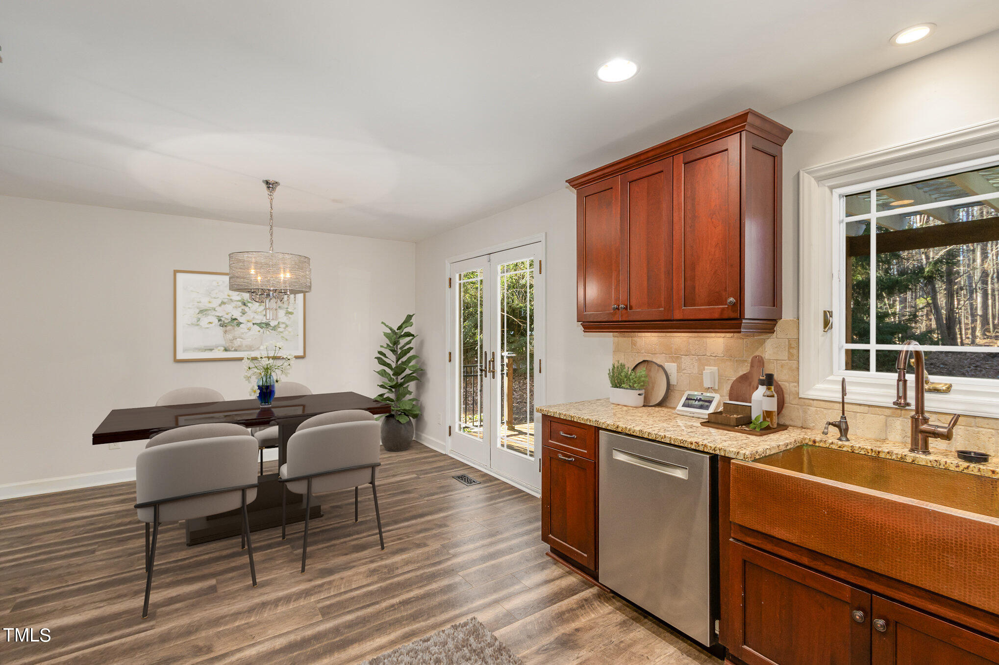 2903 Tavistock Drive Durham, NC 27712 - Photo 10 of 28 a living room with stainless steel appliances granite countertop furniture a rug a lamp and a window