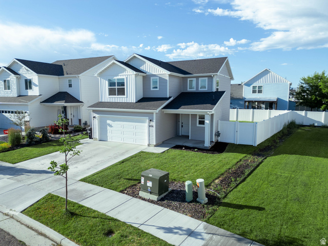 1486 West 2055th Street South Logan, UT 84339 - Photo 1 of 45 Modern two-story residence featuring light gray siding and white trim