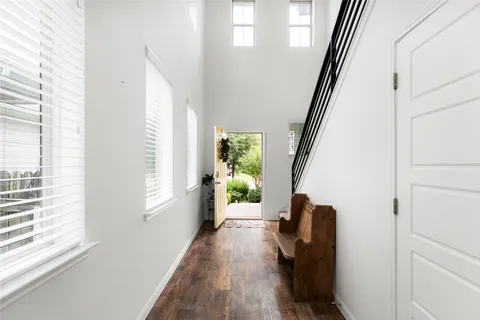 a view of an entryway with wooden floor