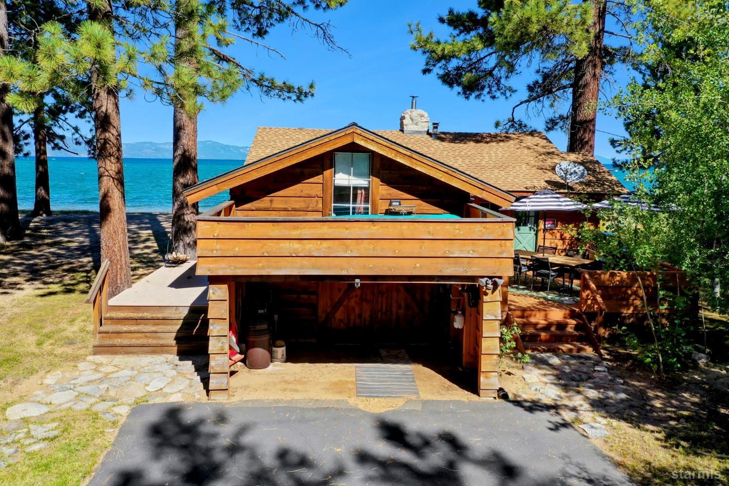 3865 Beach Road South Lake Tahoe, CA 96150 - Photo 1 of 35 a front view of a house with garden