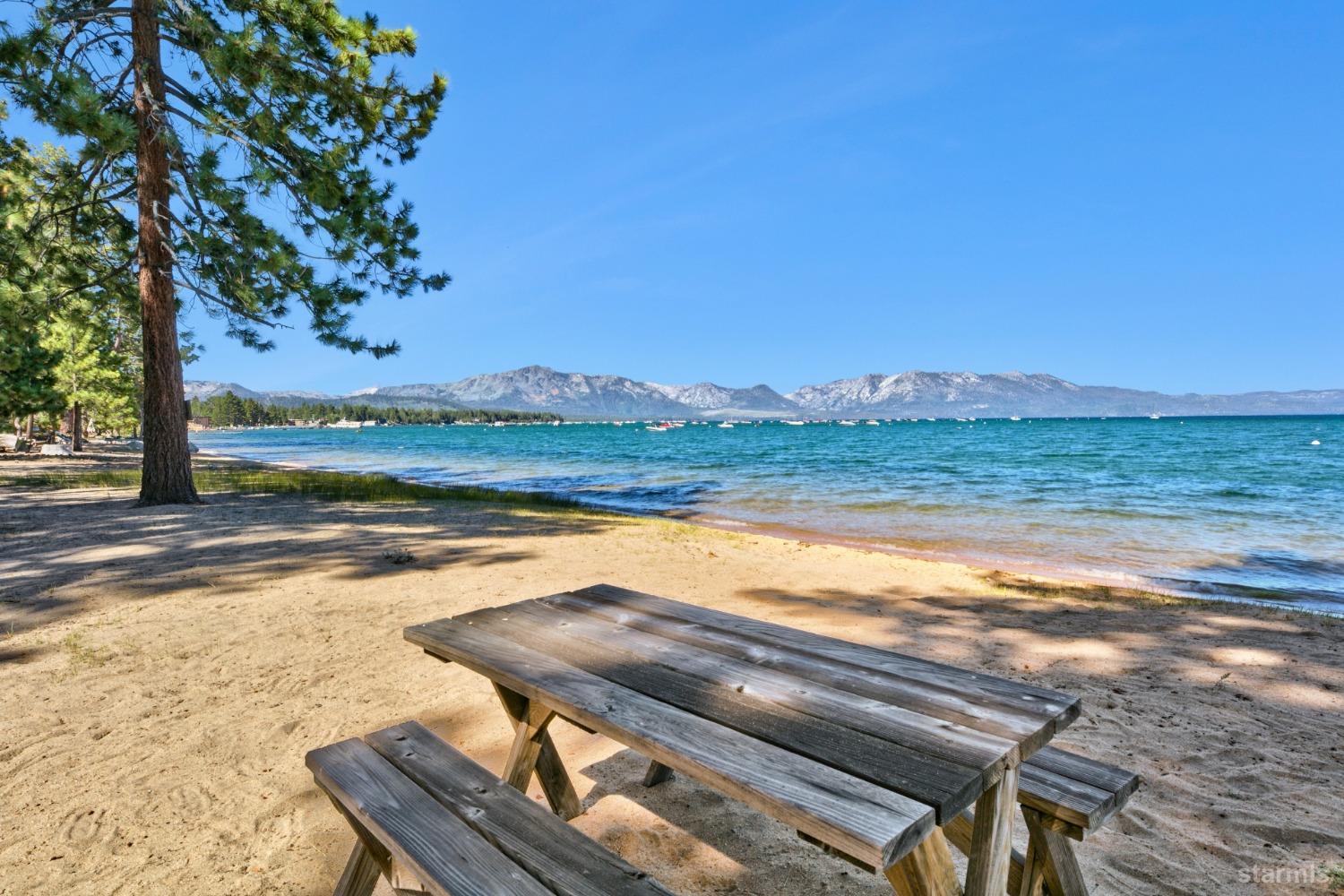 3865 Beach Road South Lake Tahoe, CA 96150 - Photo 12 of 35 a view of a lake with a yard