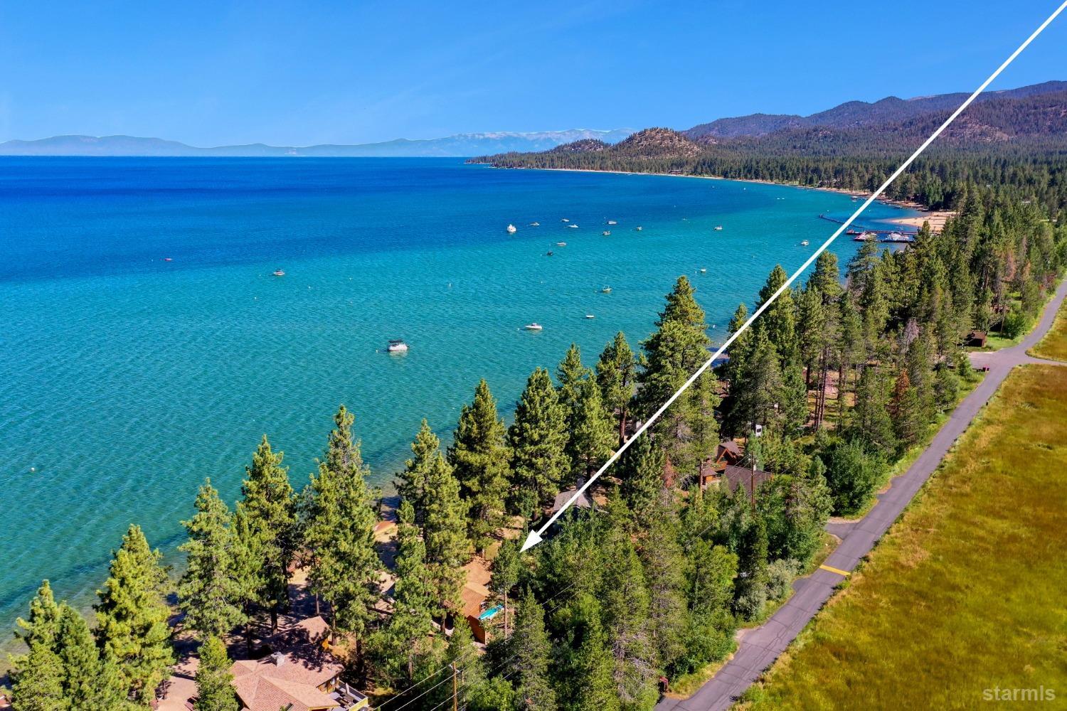 3865 Beach Road South Lake Tahoe, CA 96150 - Photo 32 of 35 a view of a lake with a mountain