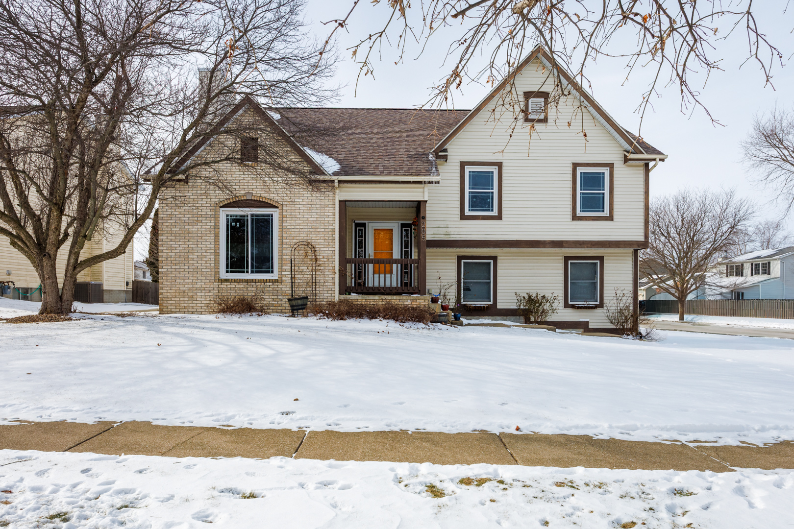 205 North Blair Drive Normal, IL 61761 - Photo 1 of 38 a front view of a house with a yard covered in snow