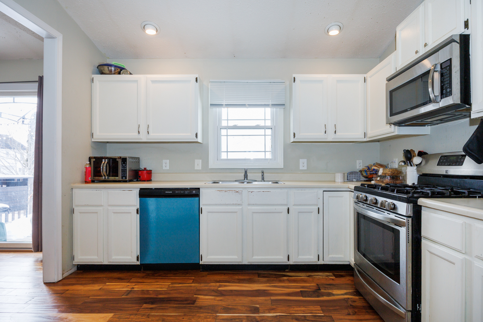 205 North Blair Drive Normal, IL 61761 - Photo 13 of 38 a kitchen with stainless steel appliances granite countertop a stove a sink and a microwave