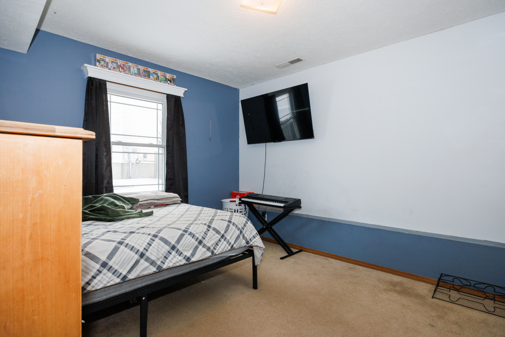 205 North Blair Drive Normal, IL 61761 - Photo 27 of 38 a bedroom with a bed and a flat screen tv
