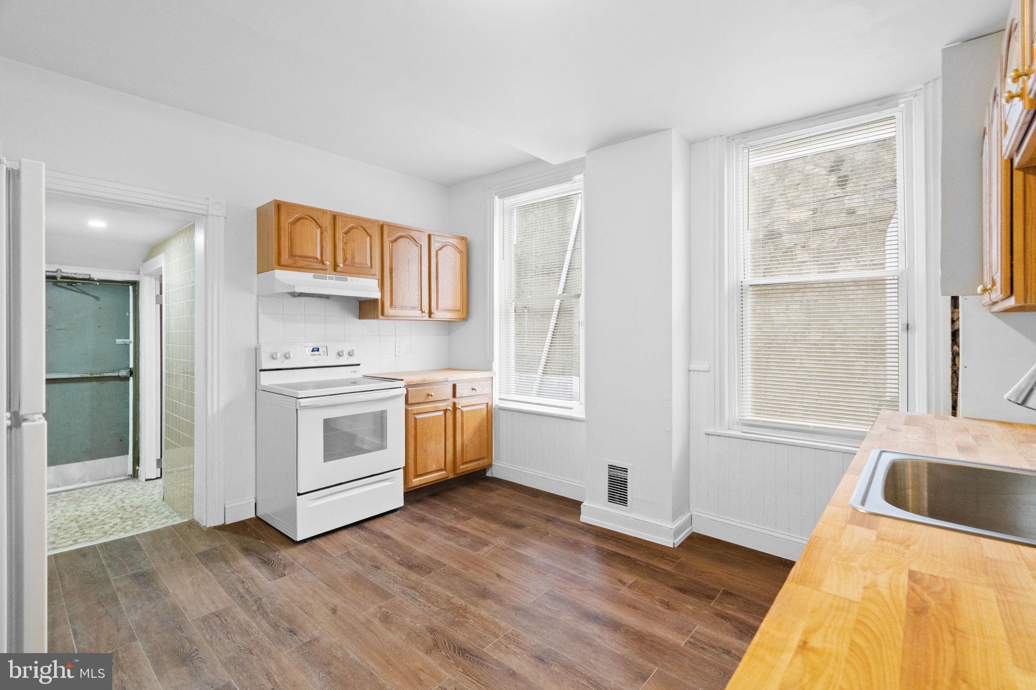 620 George Street Norristown, PA 19401 - Photo 12 of 53 a view of a kitchen with wooden floor and electronic appliances