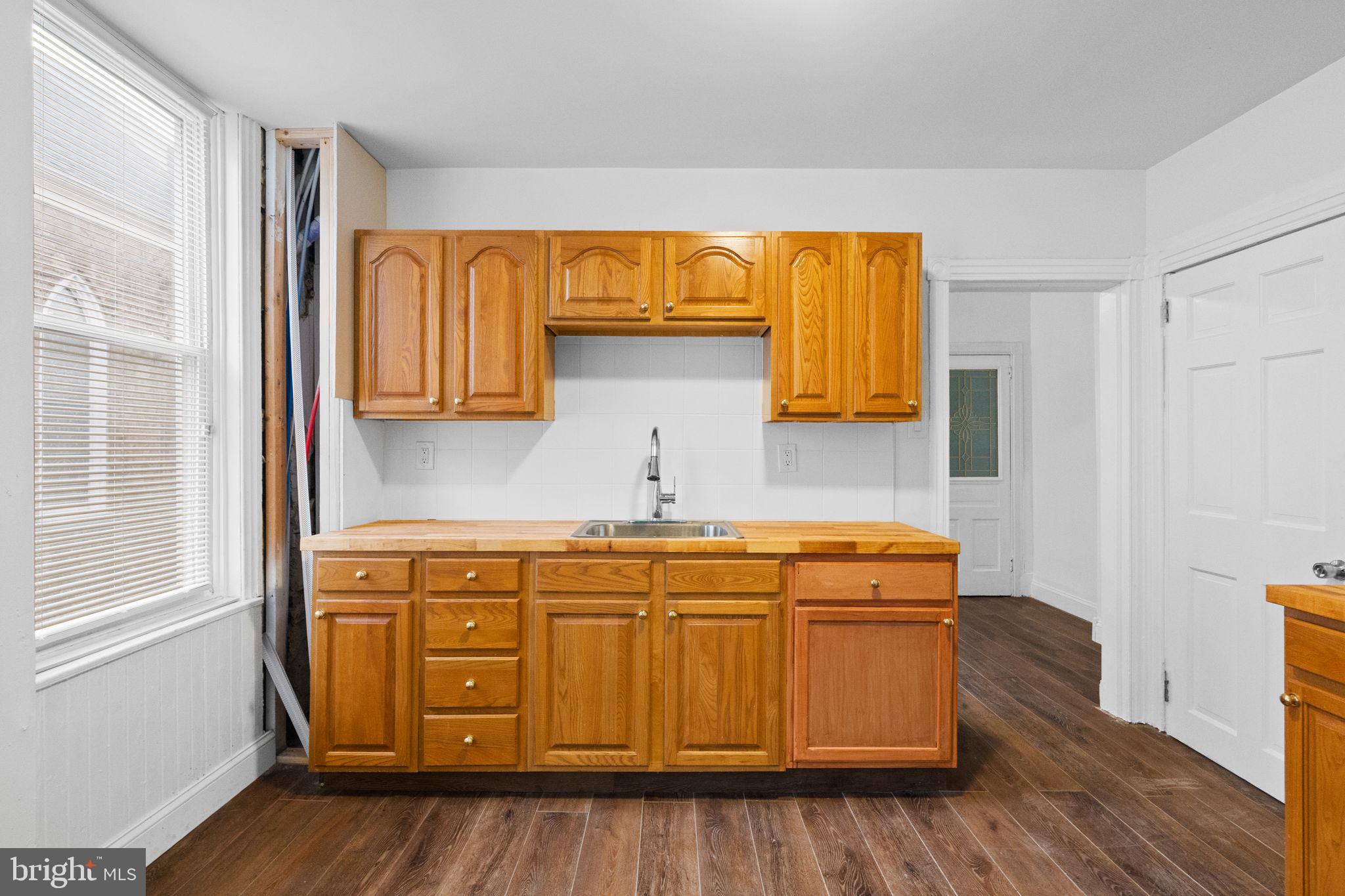 620 George Street Norristown, PA 19401 - Photo 15 of 53 a utility room with wooden floor washer and dryer