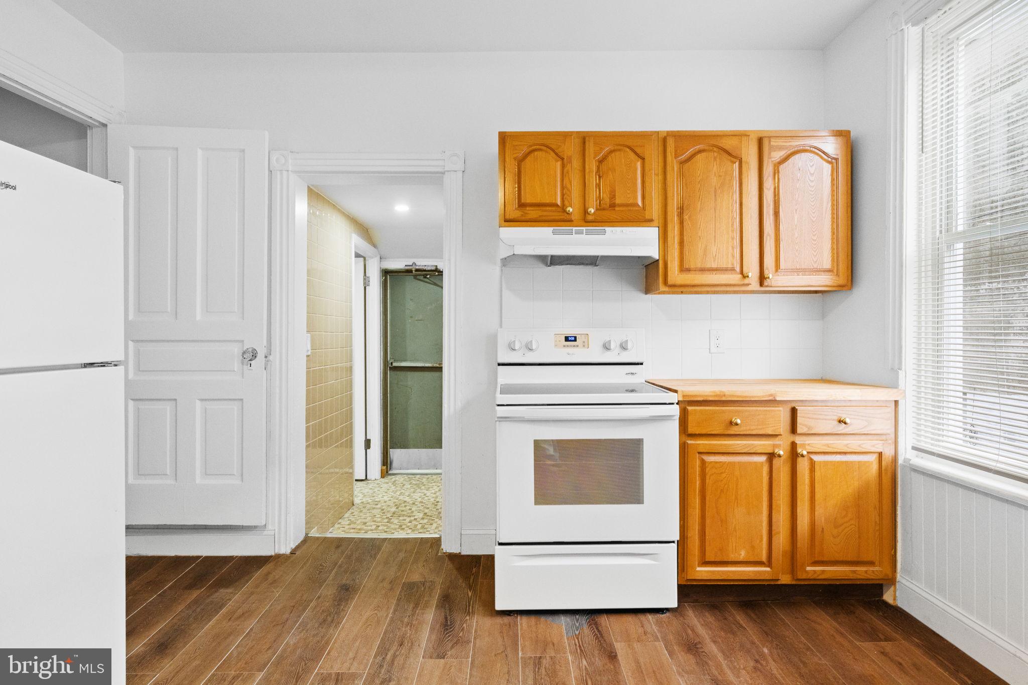 620 George Street Norristown, PA 19401 - Photo 16 of 53 a kitchen with stainless steel appliances granite countertop a refrigerator and a stove top oven
