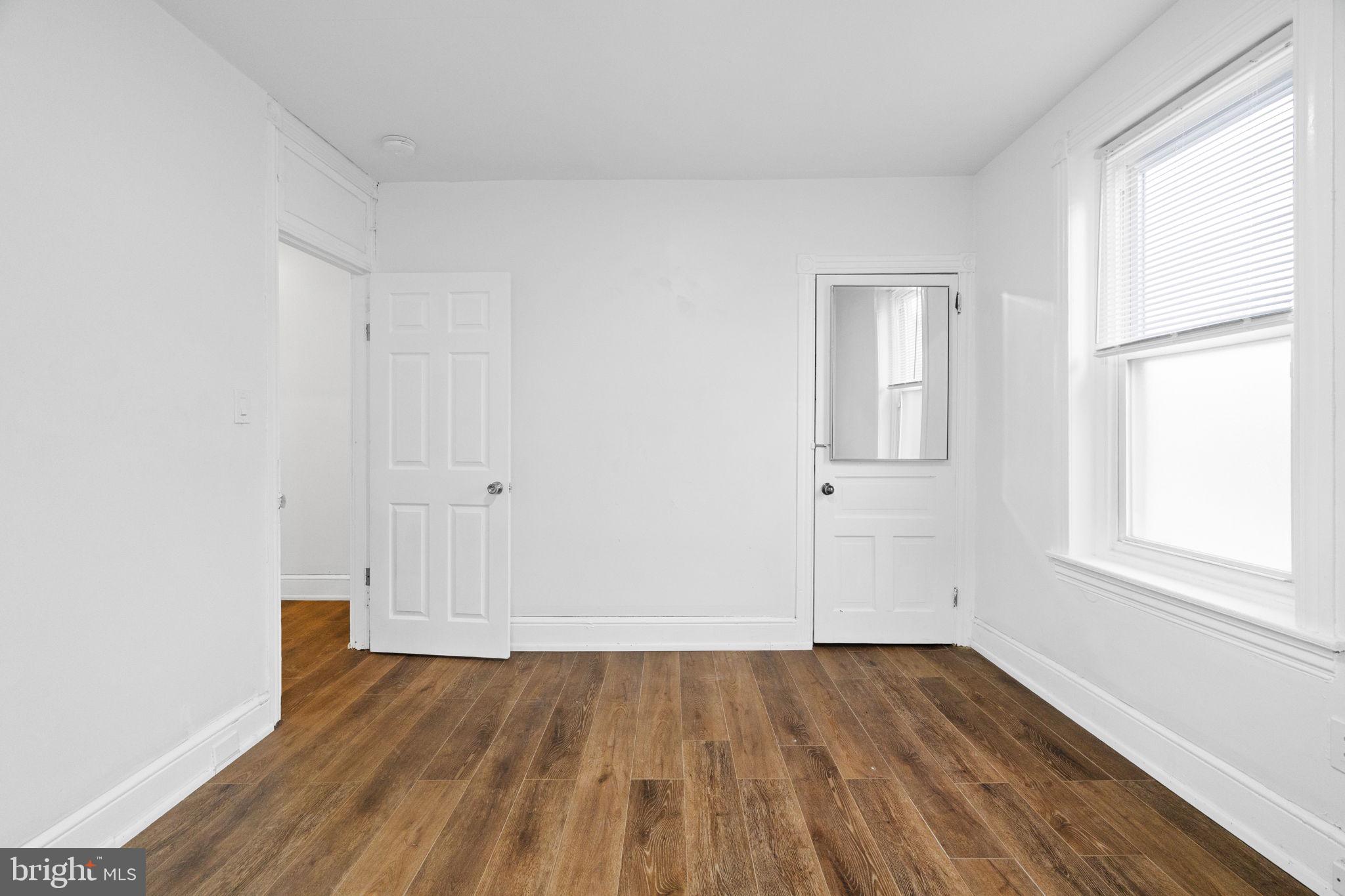 620 George Street Norristown, PA 19401 - Photo 28 of 53 an empty room with wooden floor and windows