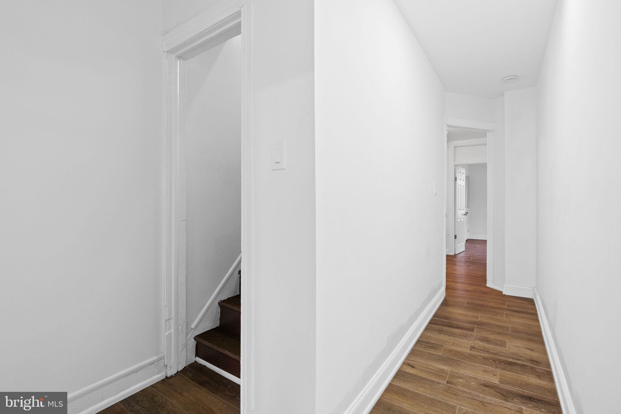 620 George Street Norristown, PA 19401 - Photo 33 of 53 a view of a hallway with wooden floor and staircase