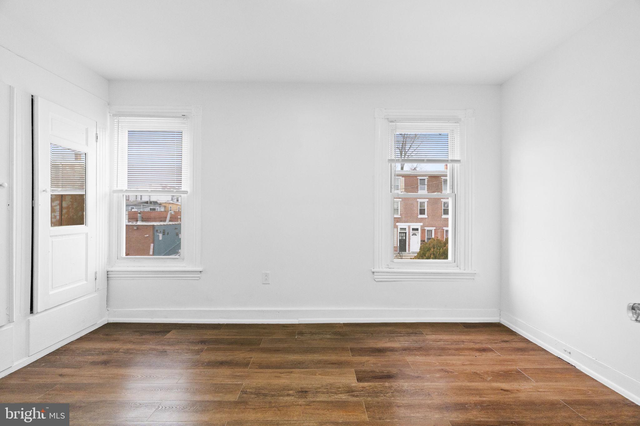 620 George Street Norristown, PA 19401 - Photo 34 of 53 an empty room with wooden floor and windows
