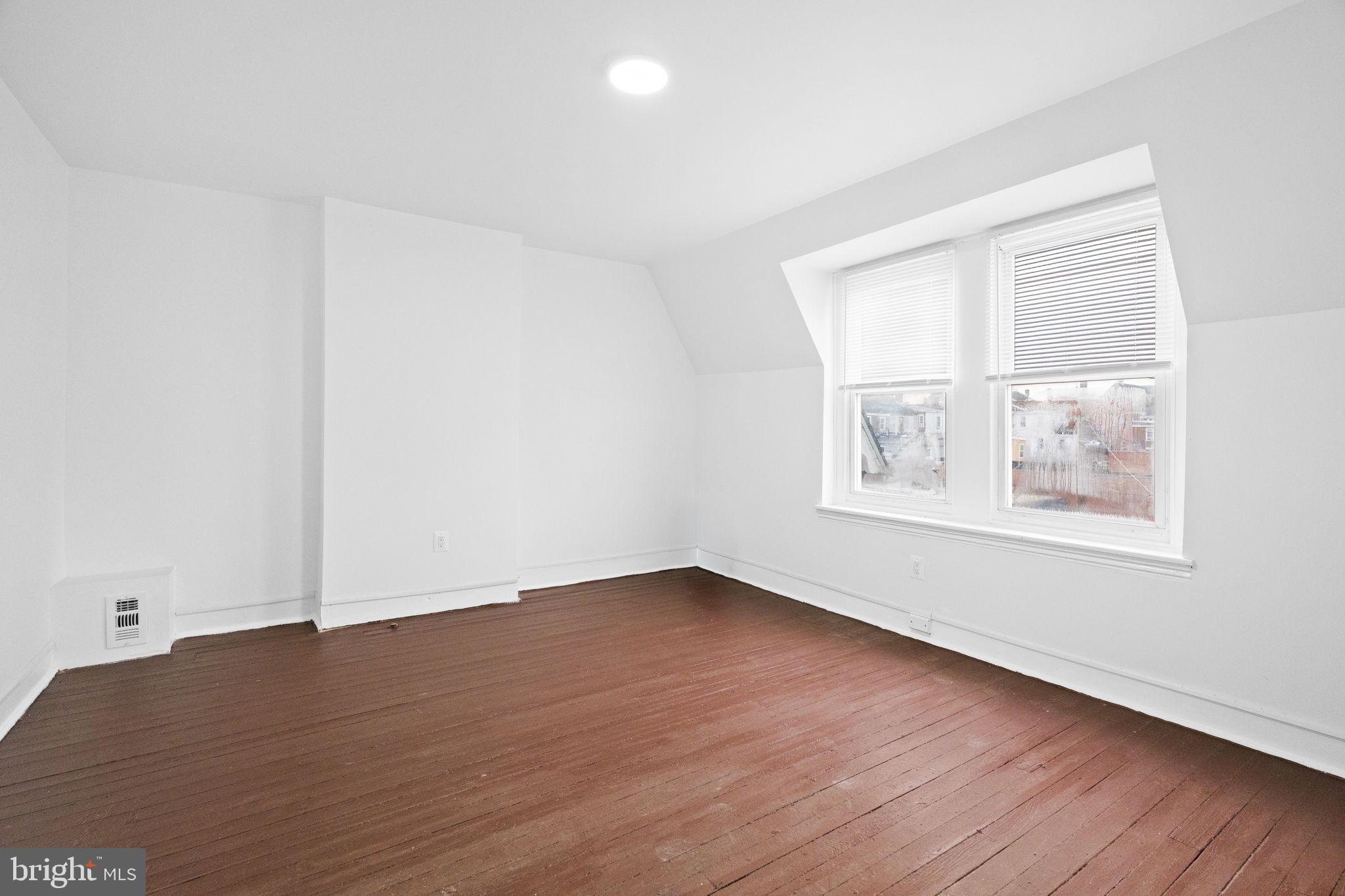620 George Street Norristown, PA 19401 - Photo 44 of 53 an empty room with wooden floor and windows