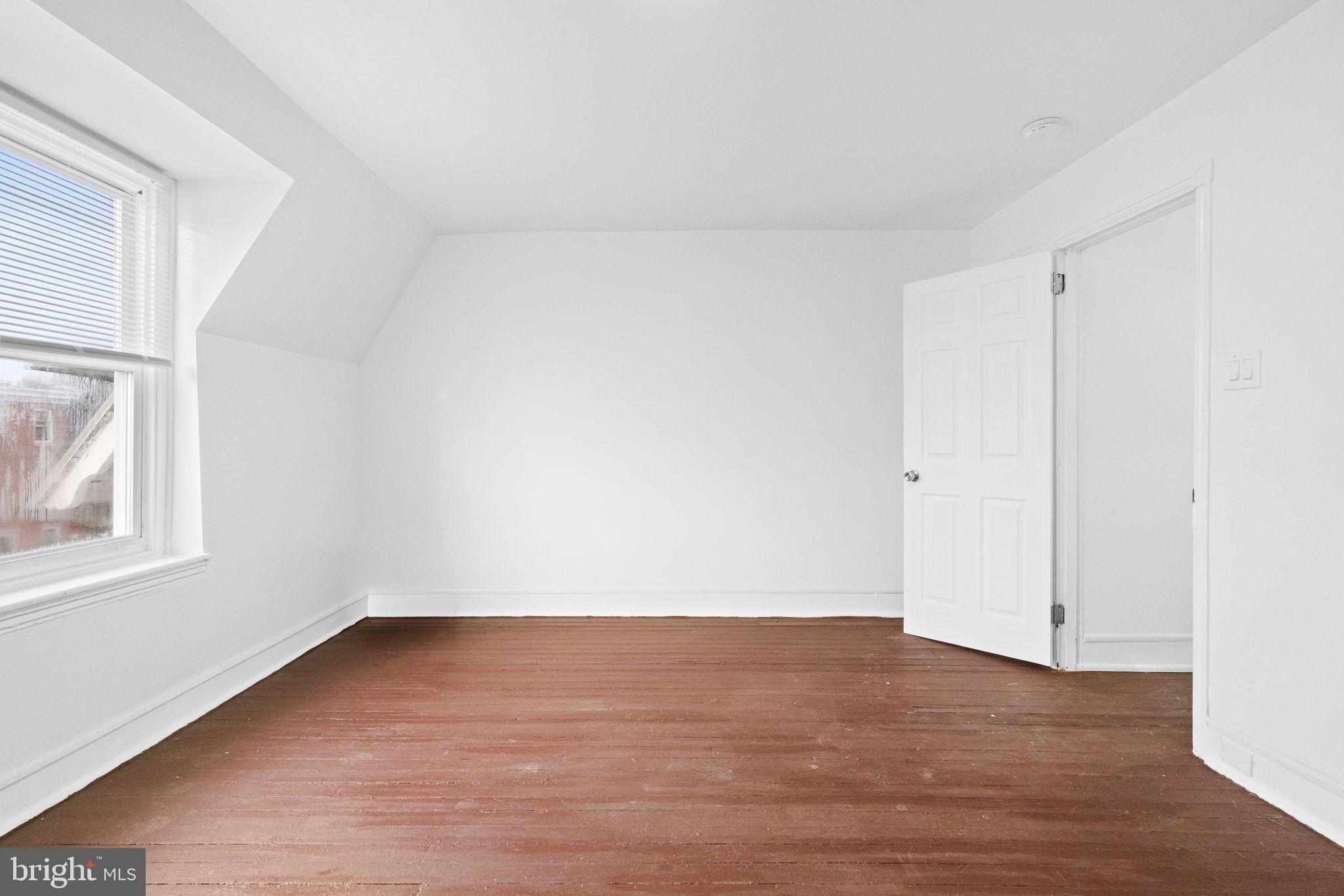 620 George Street Norristown, PA 19401 - Photo 45 of 53 a view of an empty room with wooden floor and a window