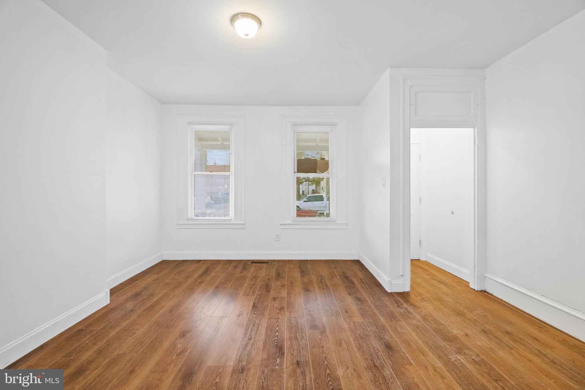 620 George Street Norristown, PA 19401 - Photo 9 of 53 an empty room with wooden floor and windows