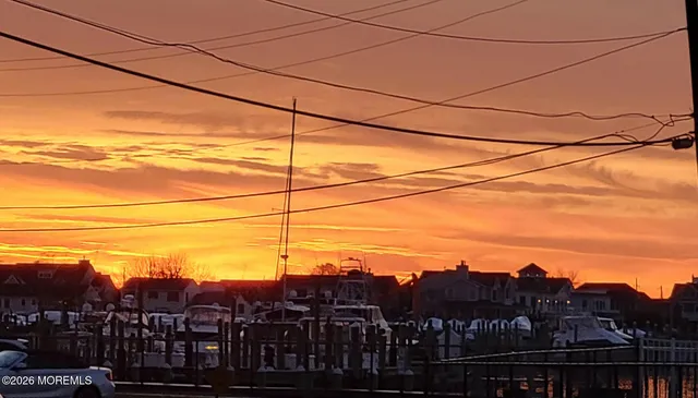 a sign that is in front of flowers