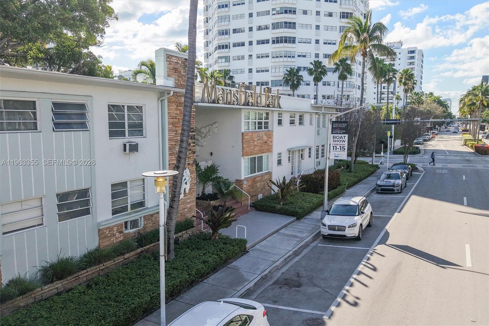 1925 Washington Avenue, Unit 21 Miami Beach, FL 33139 - Photo 15 of 16 a backyard of a house with yard and outdoor seating