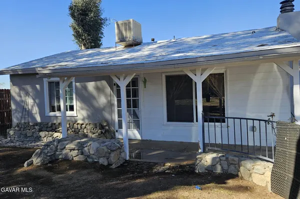 a front view of a house with yard