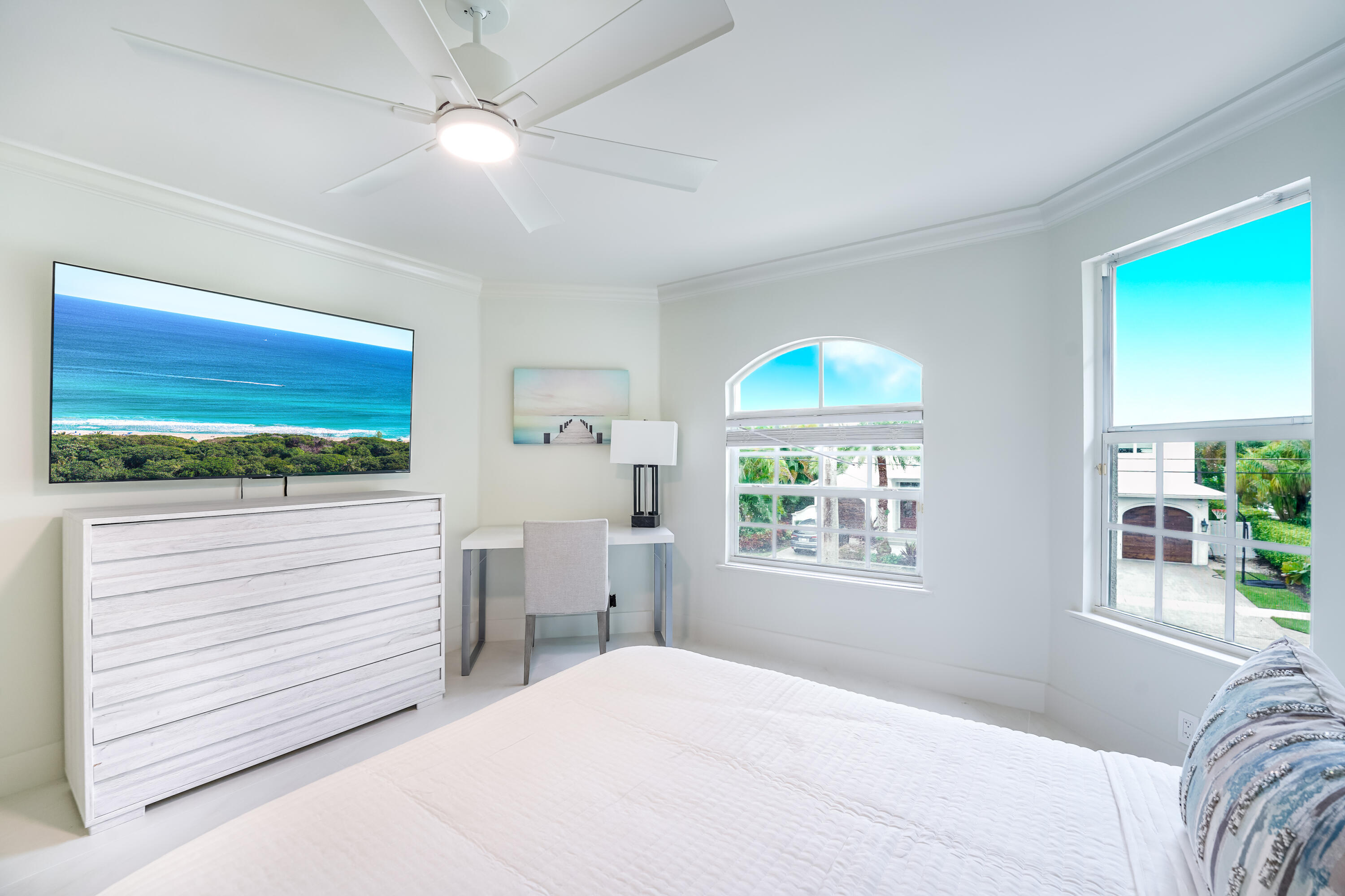 749 Northeast 71st Street Boca Raton, FL 33487 - Photo 28 of 43 a bedroom with a bed and a window