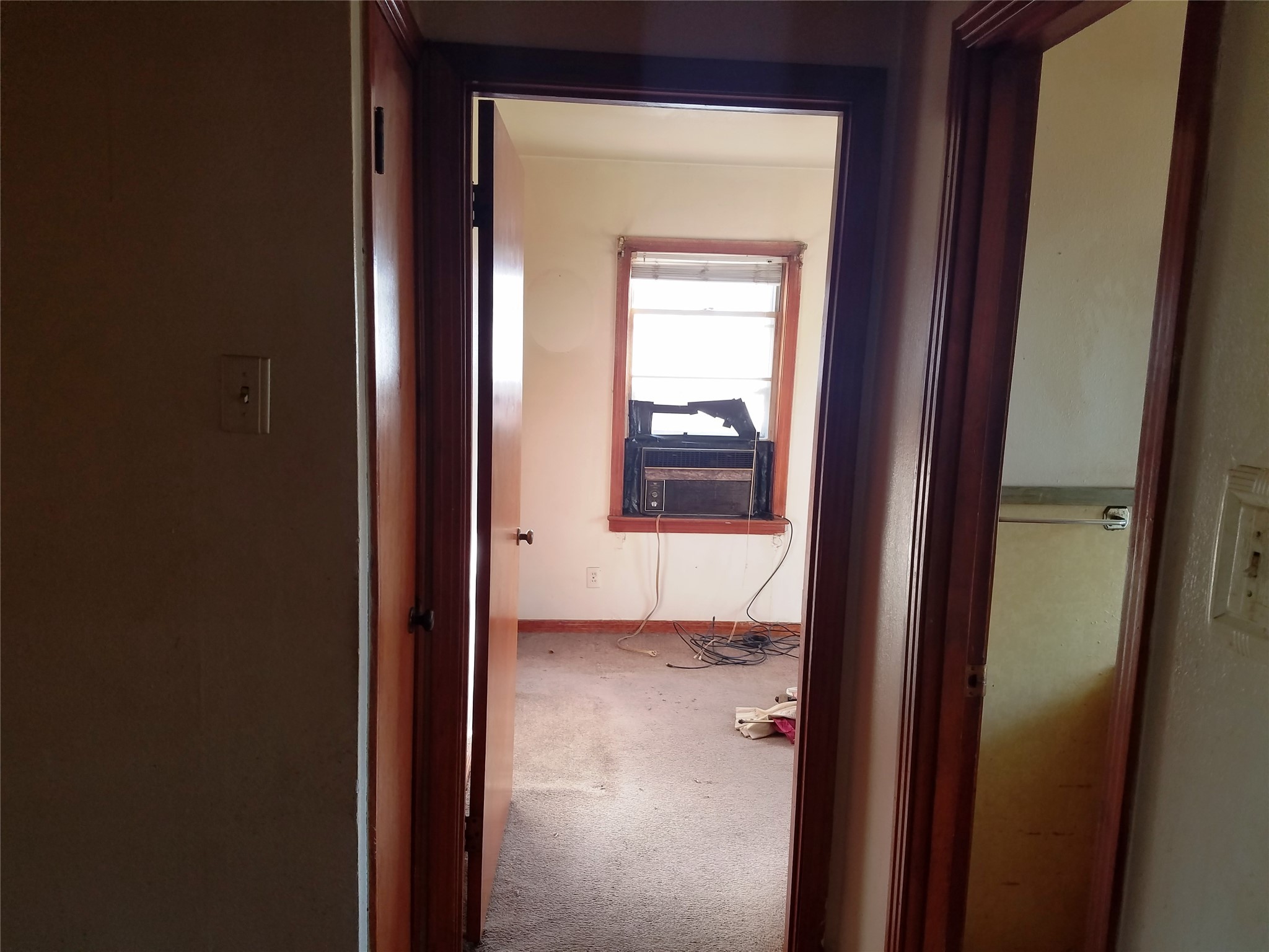 4460 South 5th Street Beaumont, TX 77705 - Photo 3 of 6 a view of a bathroom from a hallway