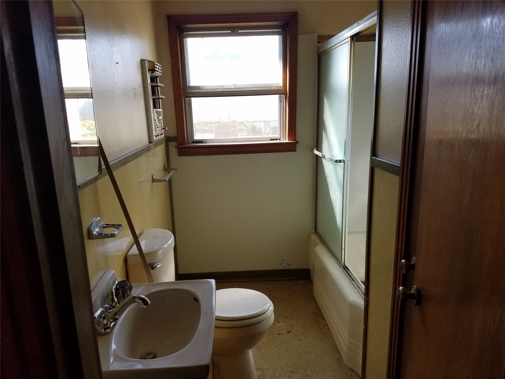 4460 South 5th Street Beaumont, TX 77705 - Photo 4 of 6 a bathroom with a toilet and a sink