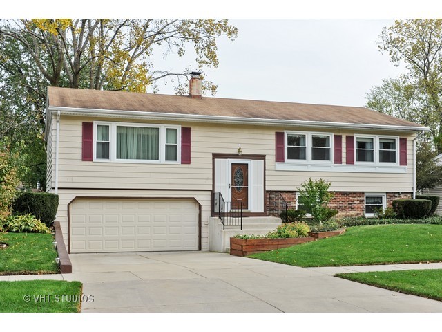 439 Weidner Road Buffalo Grove, IL 60089 - Photo 1 of 23 a front view of a house with garden