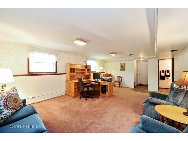 439 Weidner Road Buffalo Grove, IL 60089 - Photo 15 of 23 a living room with furniture and a large window