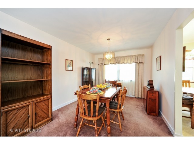 439 Weidner Road Buffalo Grove, IL 60089 - Photo 5 of 23 a view of a dining room with furniture and window