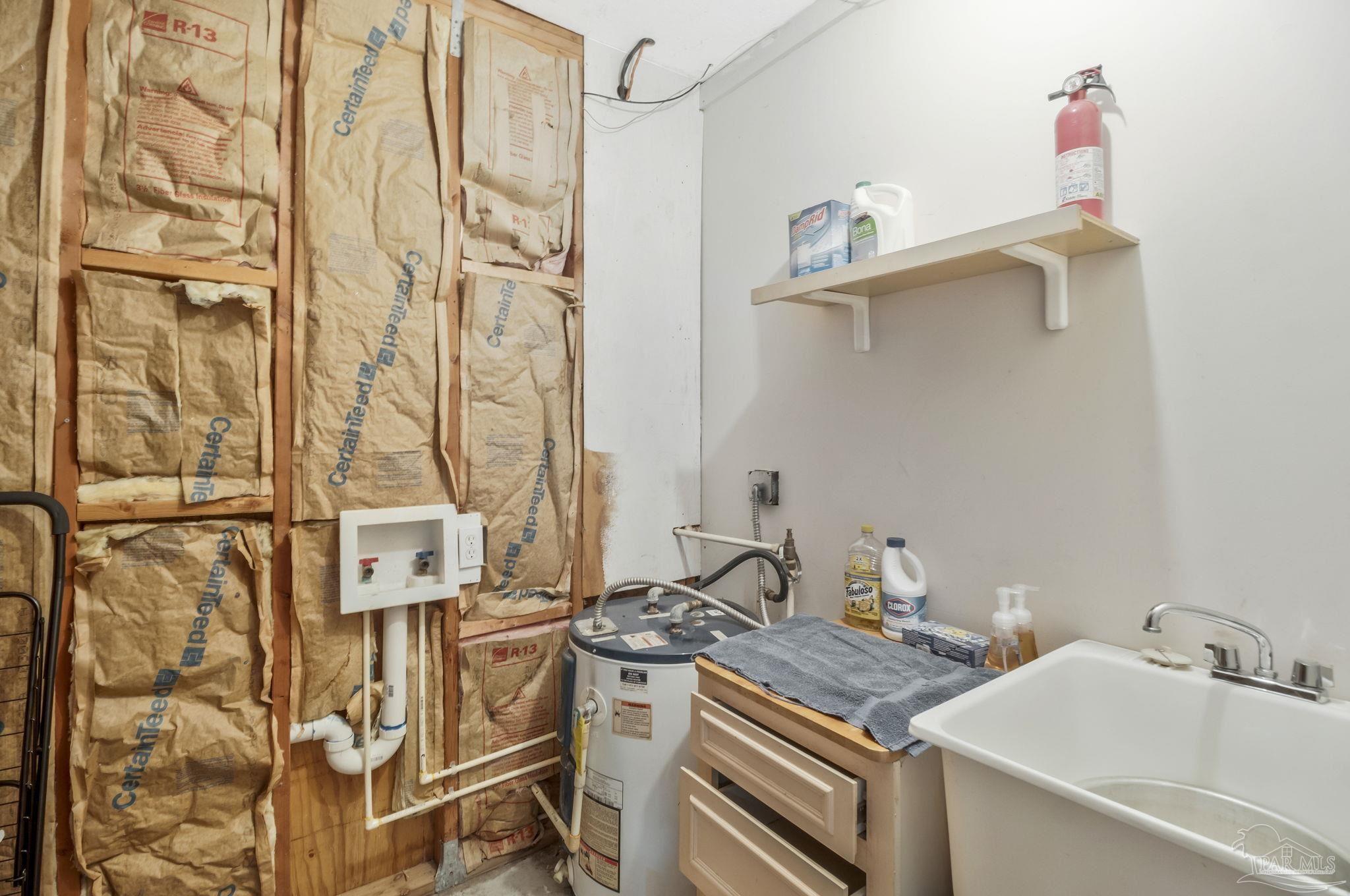 10290 West Lake Road Milton, FL 32583 - Photo 19 of 53 a bathroom with a sink and a mirror