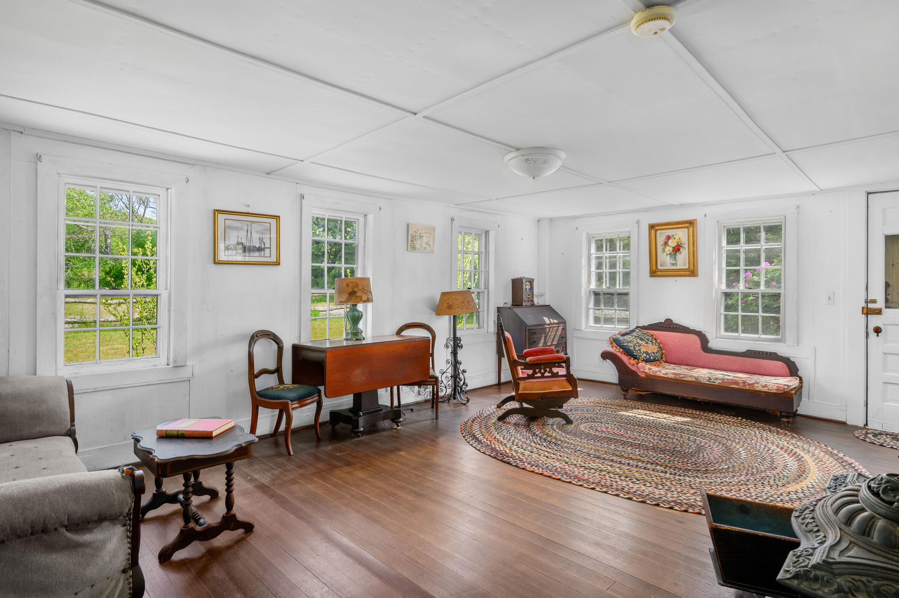 75 Massasoit Road Eastham, MA 02642 - Photo 19 of 49 a living room with furniture a wooden floor and a window