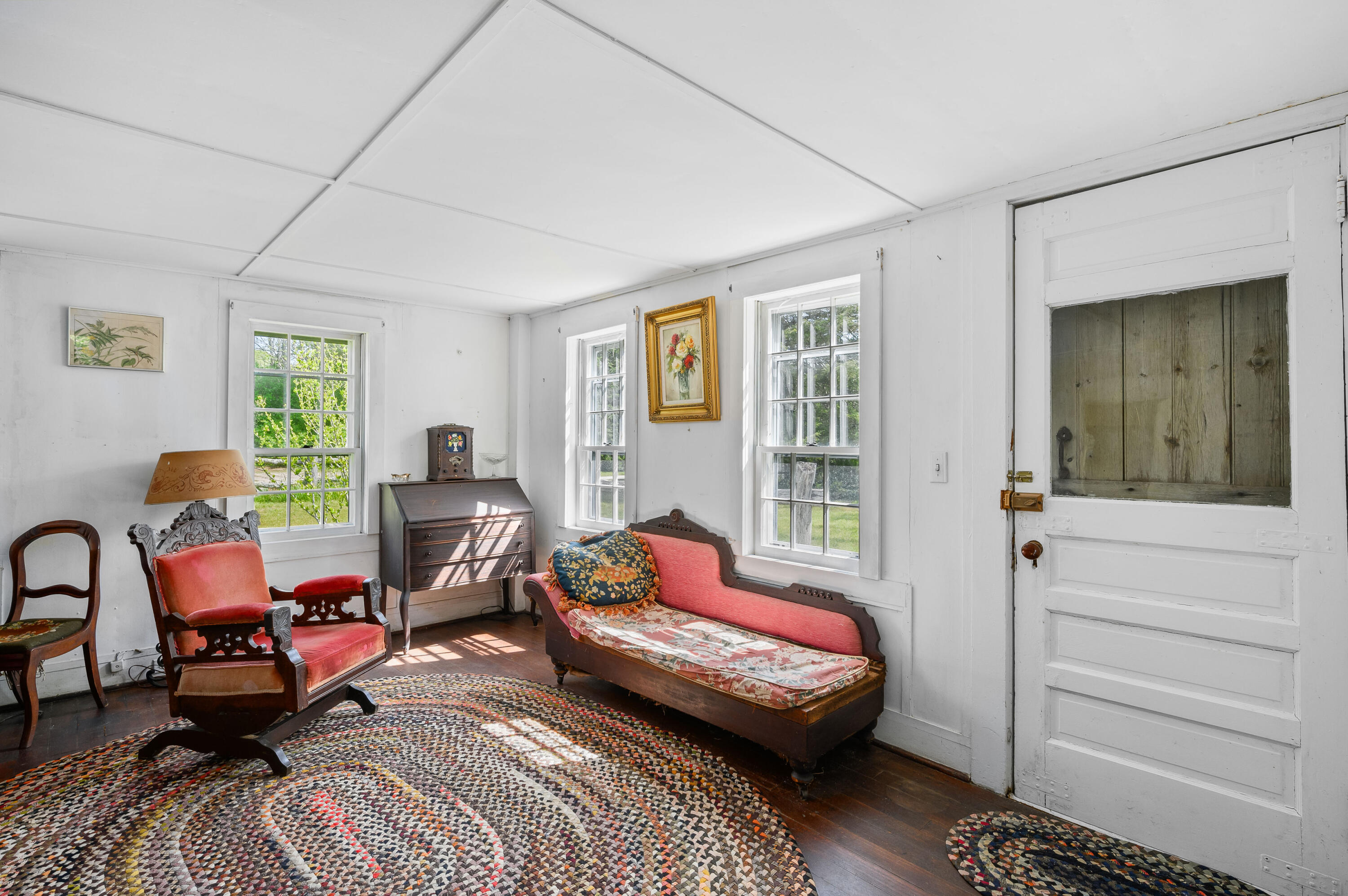 75 Massasoit Road Eastham, MA 02642 - Photo 23 of 49 a living room with furniture a rug and a window