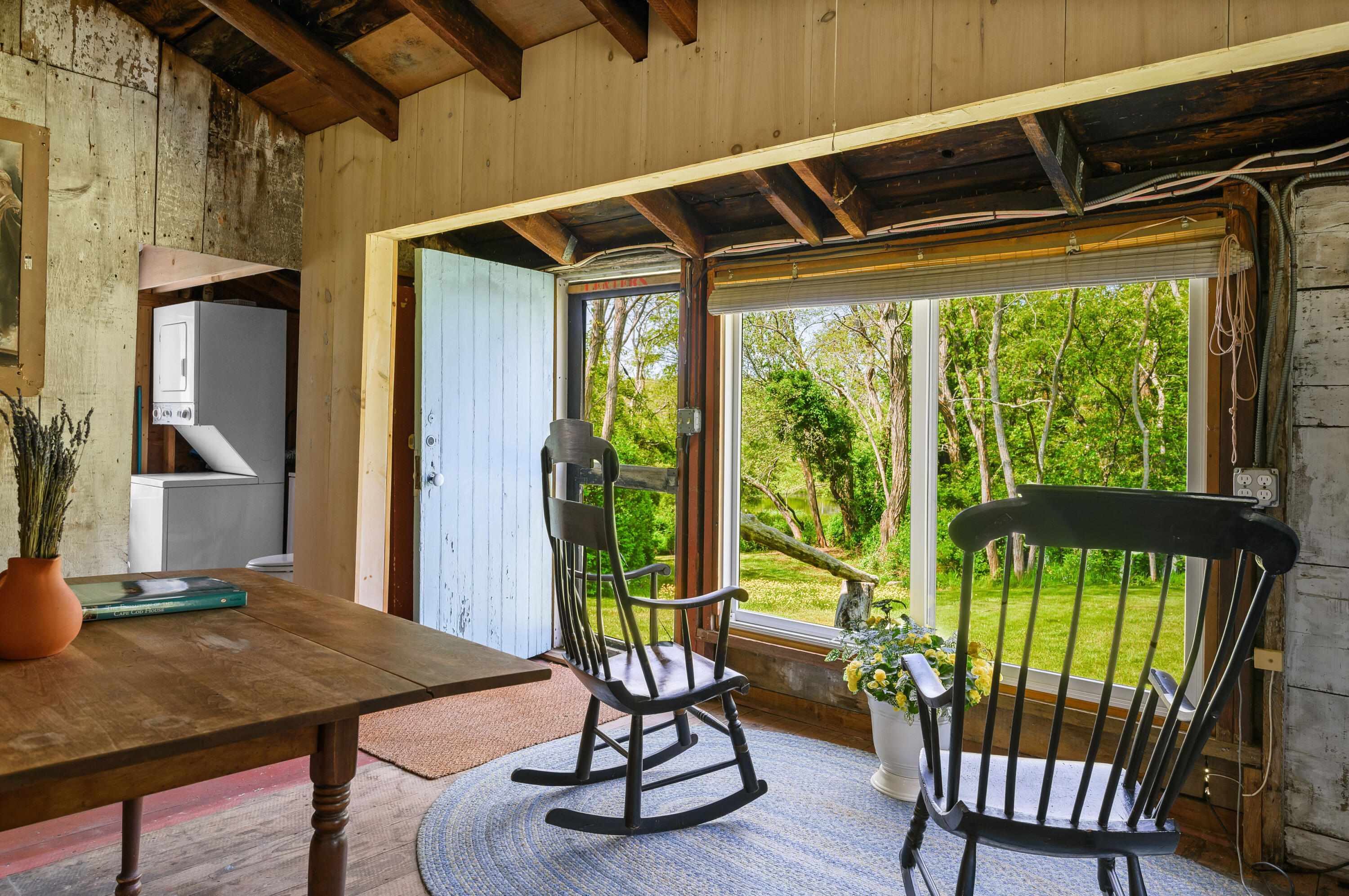 75 Massasoit Road Eastham, MA 02642 - Photo 32 of 49 a view of a porch with furniture and a yard