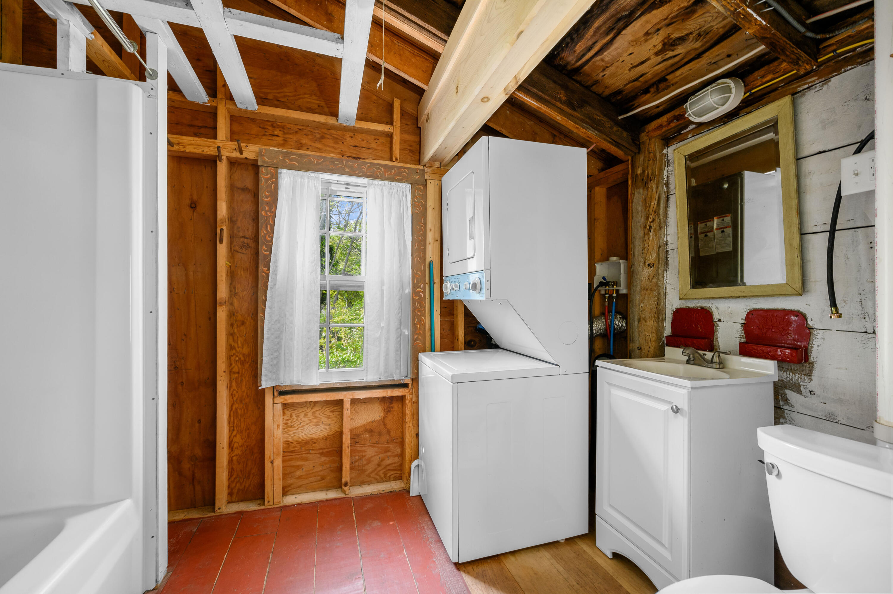 75 Massasoit Road Eastham, MA 02642 - Photo 34 of 49 a view of washer and dryer with bathroom in the background