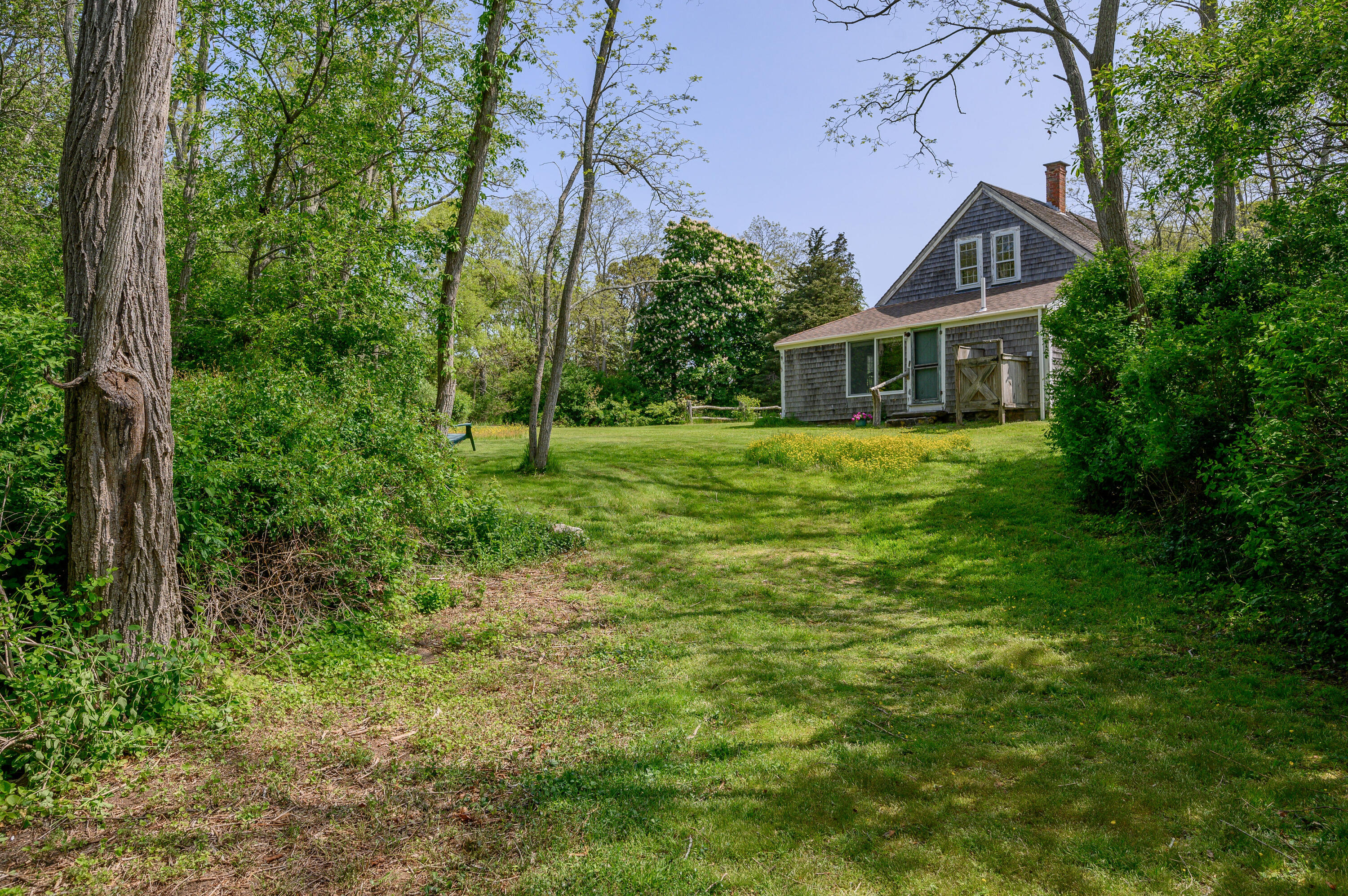 75 Massasoit Road Eastham, MA 02642 - Photo 40 of 49 a front view of a house with a yard