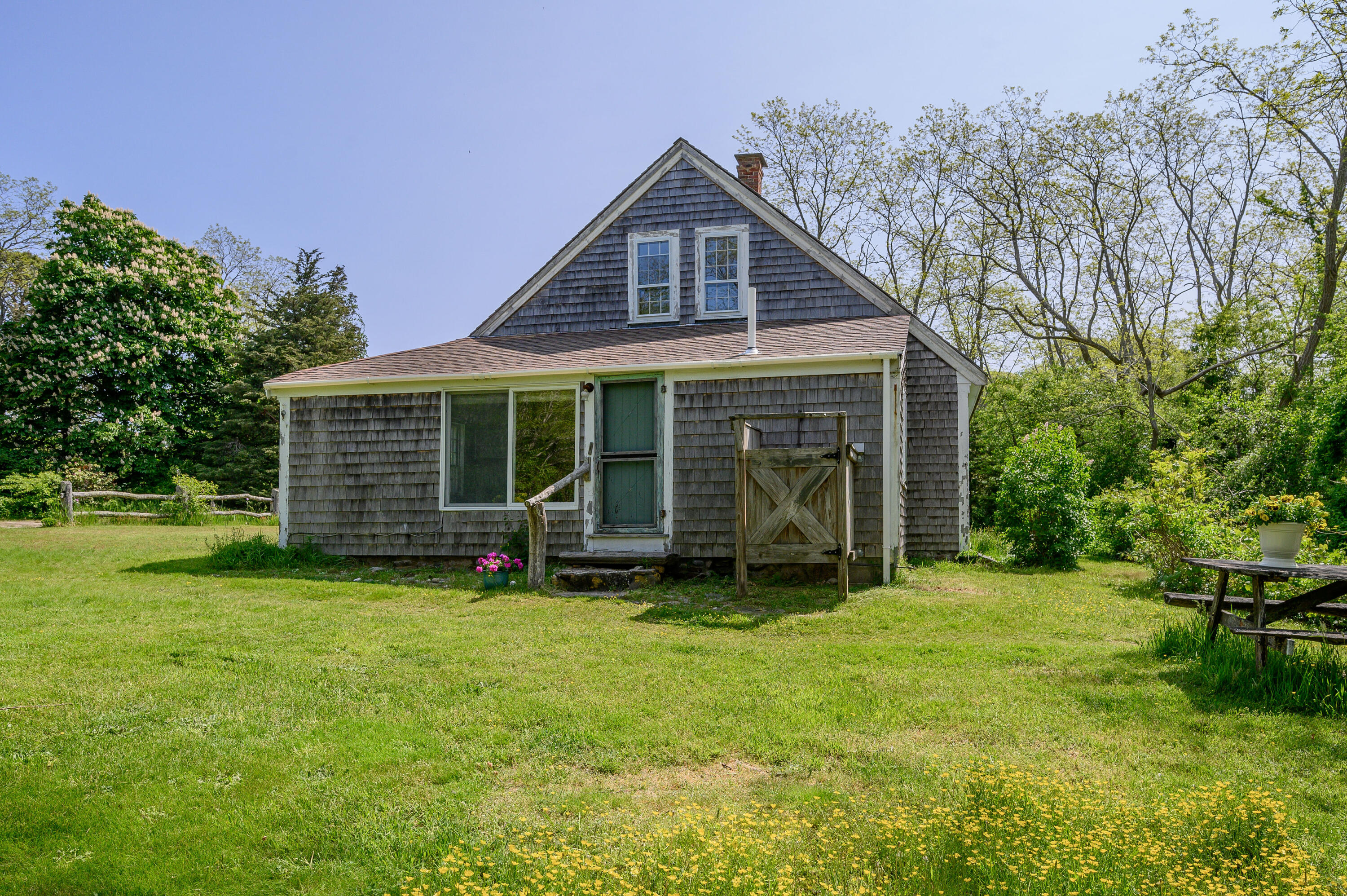 75 Massasoit Road Eastham, MA 02642 - Photo 4 of 49 a view of a house with a yard