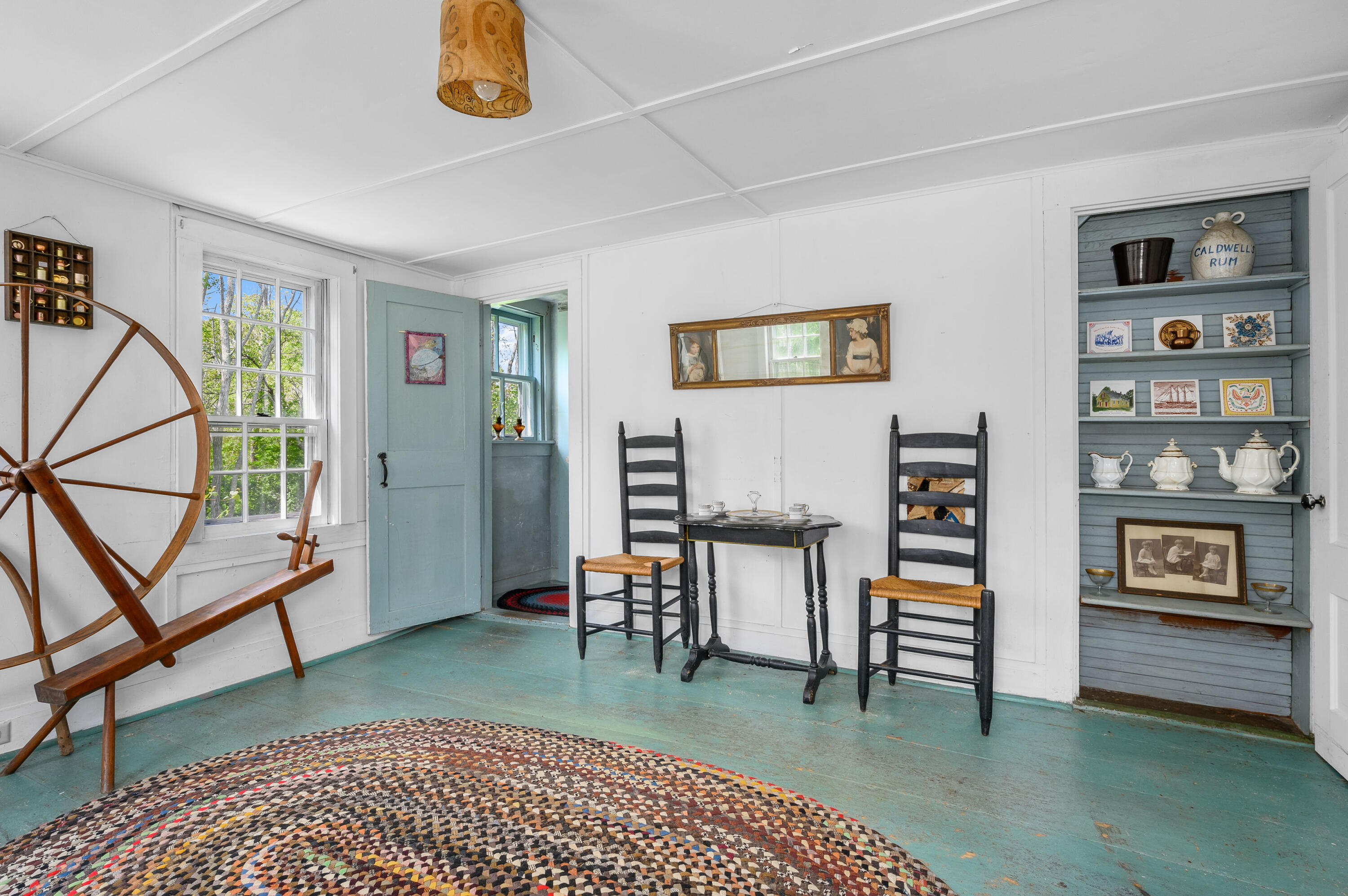 75 Massasoit Road Eastham, MA 02642 - Photo 10 of 49 a view of living room filled with furniture and book shelf