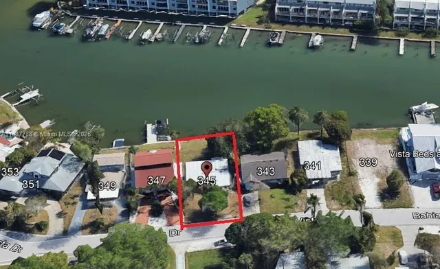 an aerial view of houses with yard