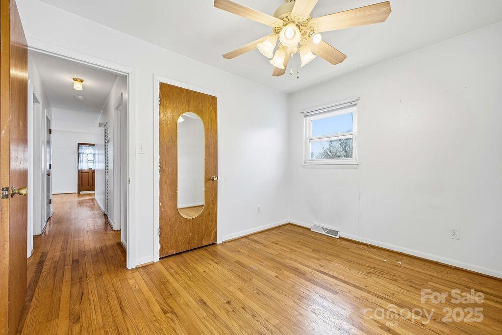 50 Huffman Road Asheville, NC 28806 - Photo 12 of 19 wooden floor in an empty room with a window