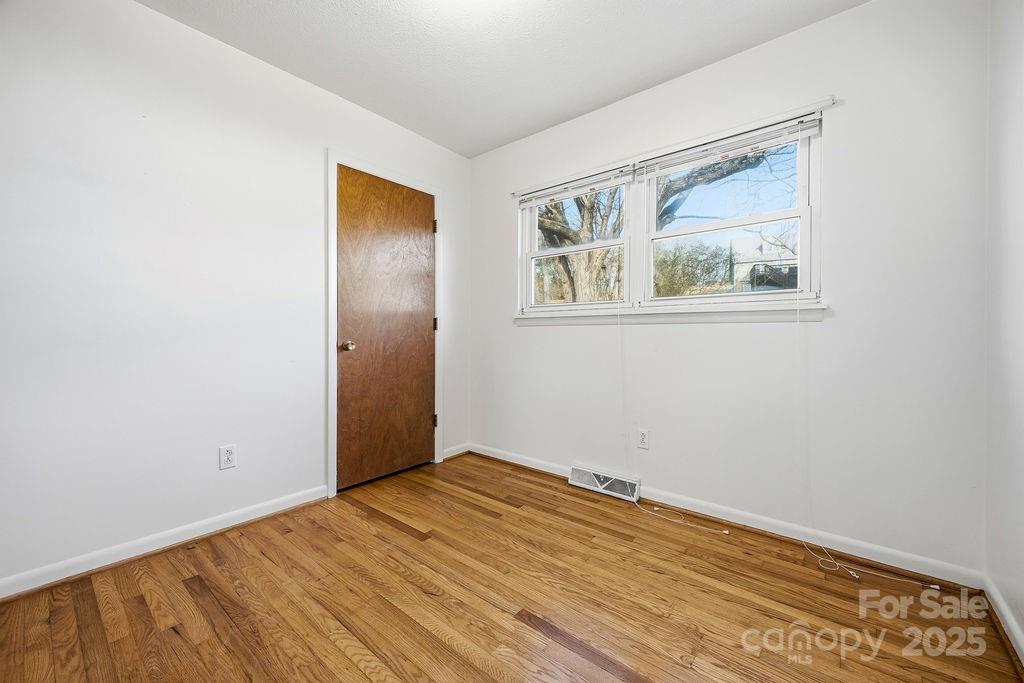 50 Huffman Road Asheville, NC 28806 - Photo 14 of 19 an empty room with a window and closet