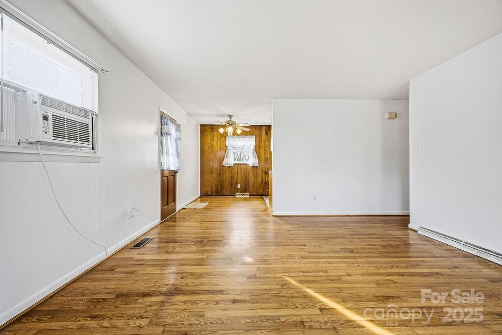 50 Huffman Road Asheville, NC 28806 - Photo 4 of 19 a view of an empty room with wooden floor and cabinet