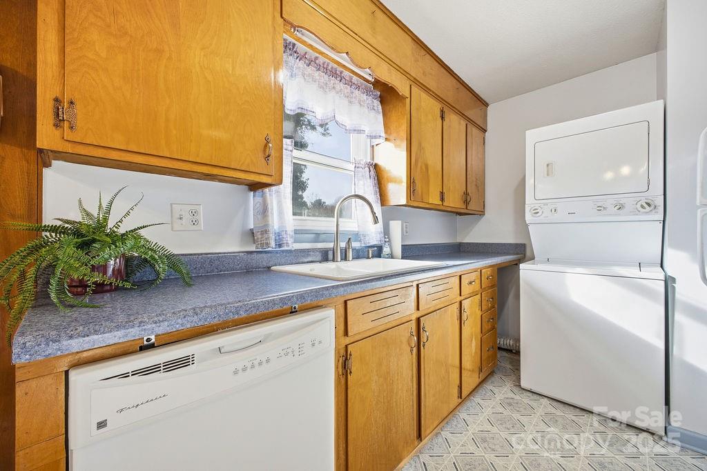 50 Huffman Road Asheville, NC 28806 - Photo 7 of 19 a kitchen with stainless steel appliances granite countertop a sink a counter space and cabinets