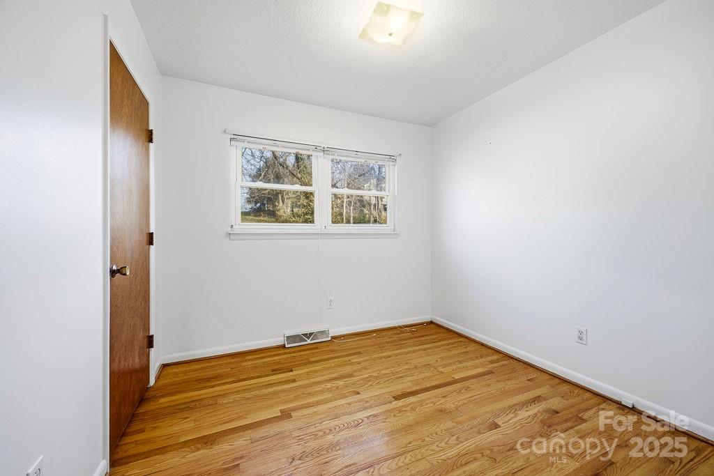 50 Huffman Road Asheville, NC 28806 - Photo 9 of 19 an empty room with a window