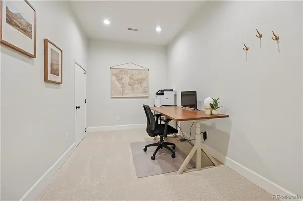 a workspace with furniture and window